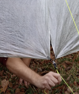 Pulling cord away from tent