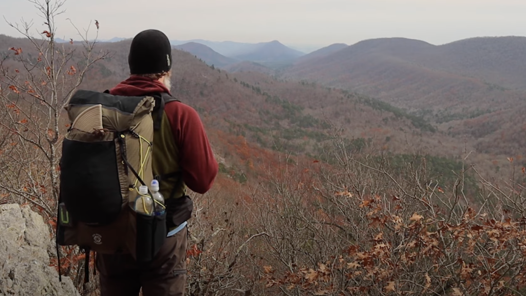 Wearing pack in mountains