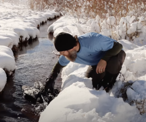 Soaking jacket in freezing stream