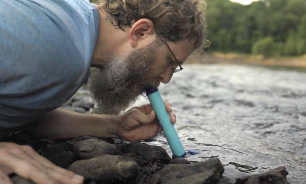 Steven drinking through Lifestraw filter